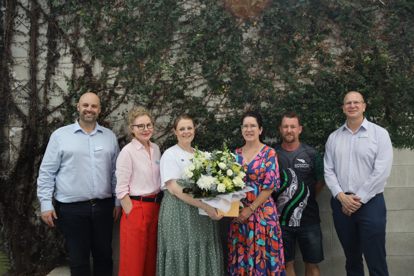 Kathryn Rodda, Churches of Christ foster carer, enjoying a celebratory morning tea with Churches of Christ staff at Kenmore in Brisbane.